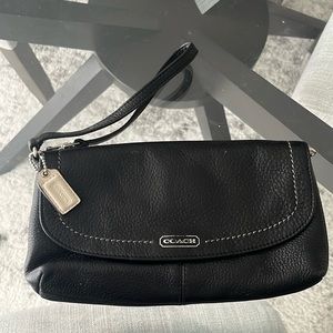 Coach wristlet with stunning teal interior. Some wear and tear - minimal.